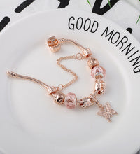 Close-up of rose gold-toned geometric heart bracelet detail