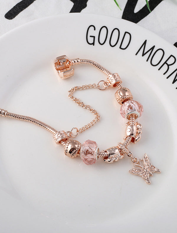 Geometric heart bracelet in rose gold on white background